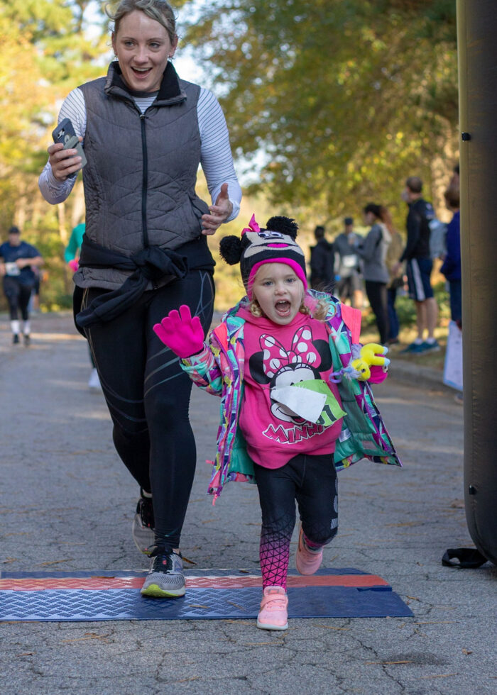 Trophy Trot kid running across finish line