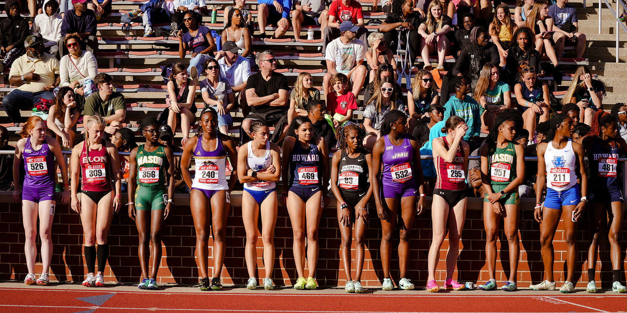 NC State University women runners preparing at the track.