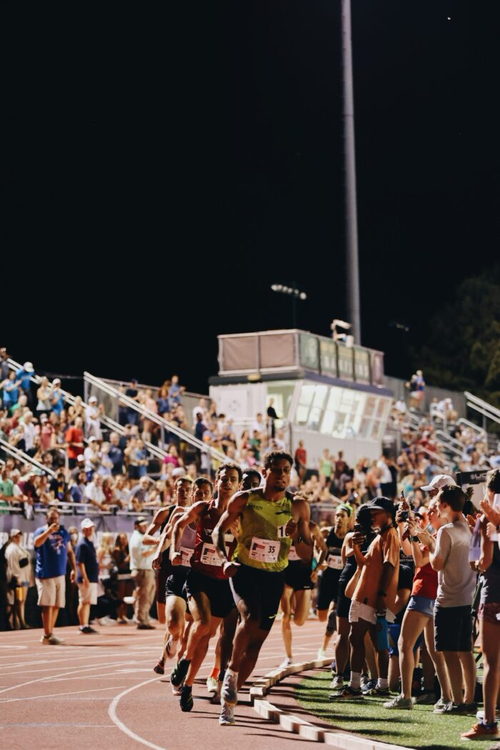 Elite runners taking the first turn at Sir Walter Miler. 