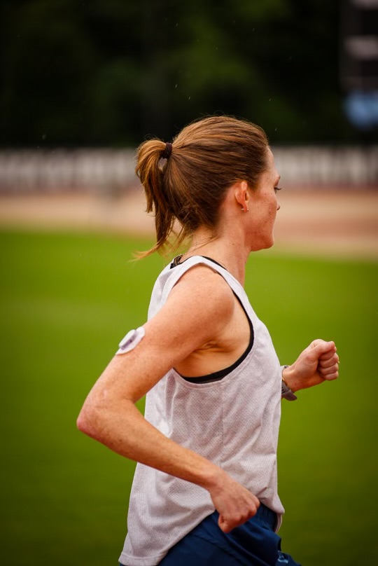 A woman running on a track