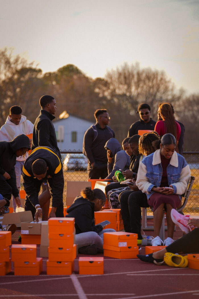 track athletes trying on new shoes